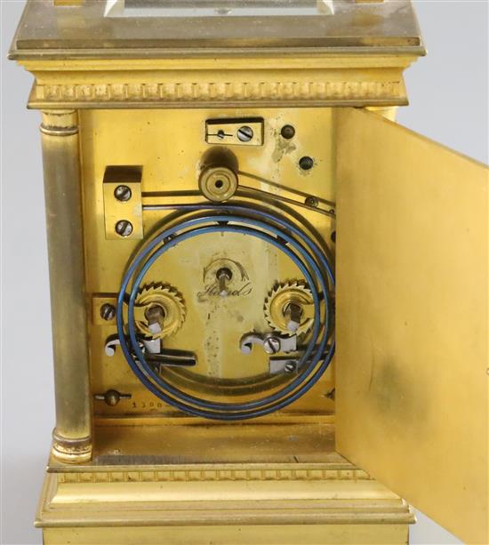 An Edwardian ormolu and porcelain hour repeating carriage clock, height 6.75in., with brown leather travelling case